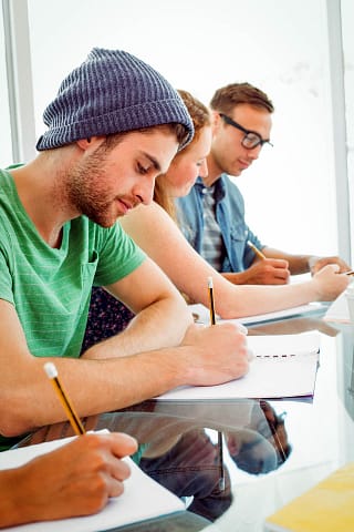 students-writing-on-notepad-at-the-college-2021-08-28-16-14-37-utc Students Writing on Notepad at the College